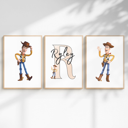 Three framed wall art prints displayed side by side on a white wall with soft shadow overlays. The center print features a large beige letter R with the name Ryley in black script, and the side prints show Woody the cowboy from Toy Story in two different poses.