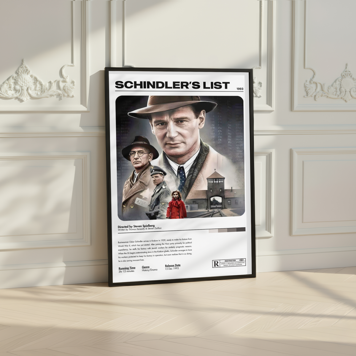 A framed 'Schindler's List' movie poster leaning against an elegant white paneled wall on a light wood floor.