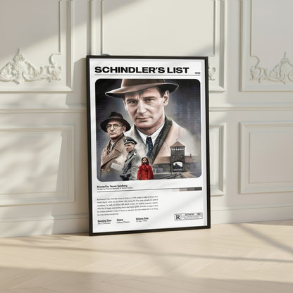 A framed 'Schindler's List' movie poster leaning against an elegant white paneled wall on a light wood floor.