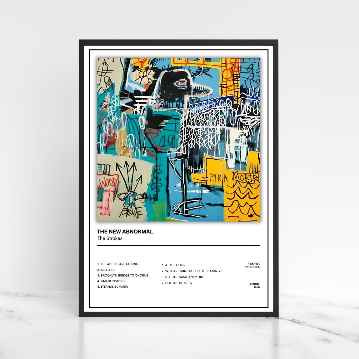 A framed music poster for The New Abnormal by The Strokes, featuring a colorful abstract graffiti-style artwork above a tracklist, shown against a light gray background.
