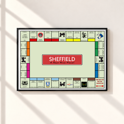 Sheffield Monopoly-style wall art print in a thin black landscape frame, featuring local bands, football clubs and Yorkshire sayings on a pale green background.