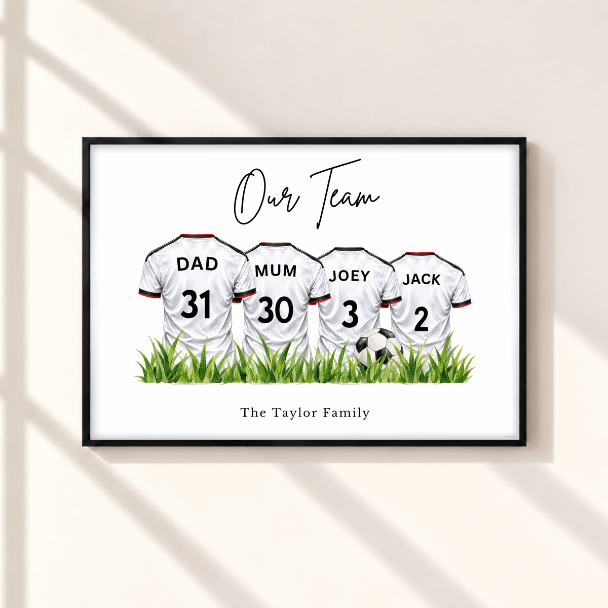 Personalised Fulham inspired family football print with four white football shirts, custom names and numbers, Our Team heading and Taylor Family wording in black frame