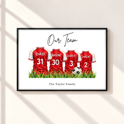 Personalised Arsenal inspired family football print with four red and white custom name and number shirts in black frame.