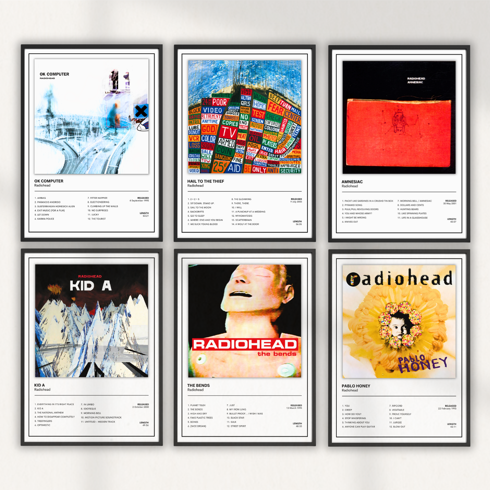 Collection of six framed Radiohead album cover prints including Pablo Honey, The Bends, OK Computer, Kid A, Amnesiac and Hail To The Thief displayed together as a modern music gallery wall for home décor.
