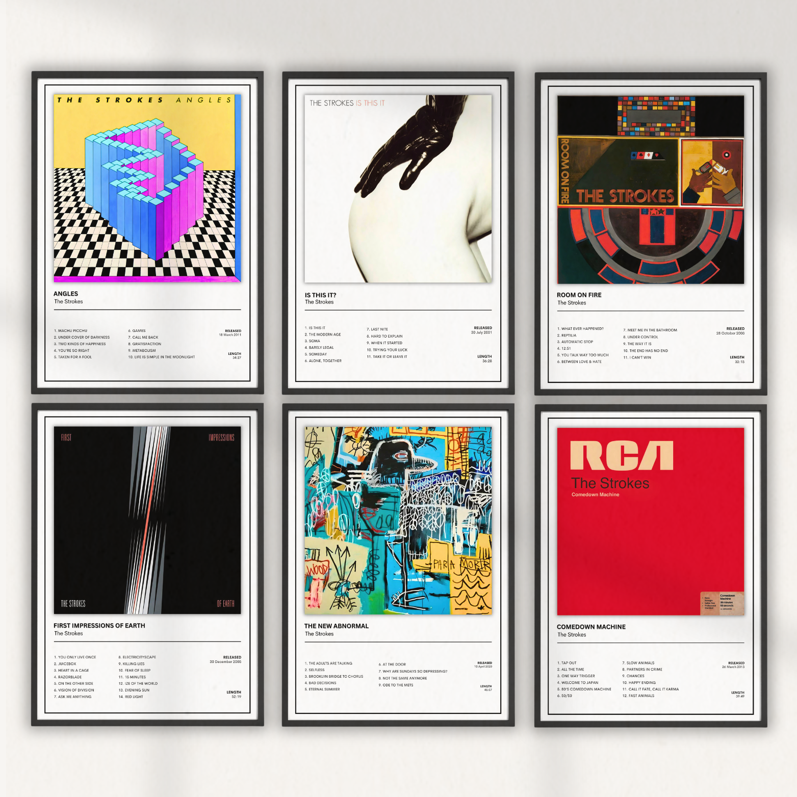 The Strokes complete studio album print collection featuring six minimalist album artwork and tracklist posters displayed in matching black frames.
