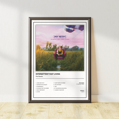 Pet Needs Intermittent Fast Living album tracklist print in a modern black frame for indie rock home decor.