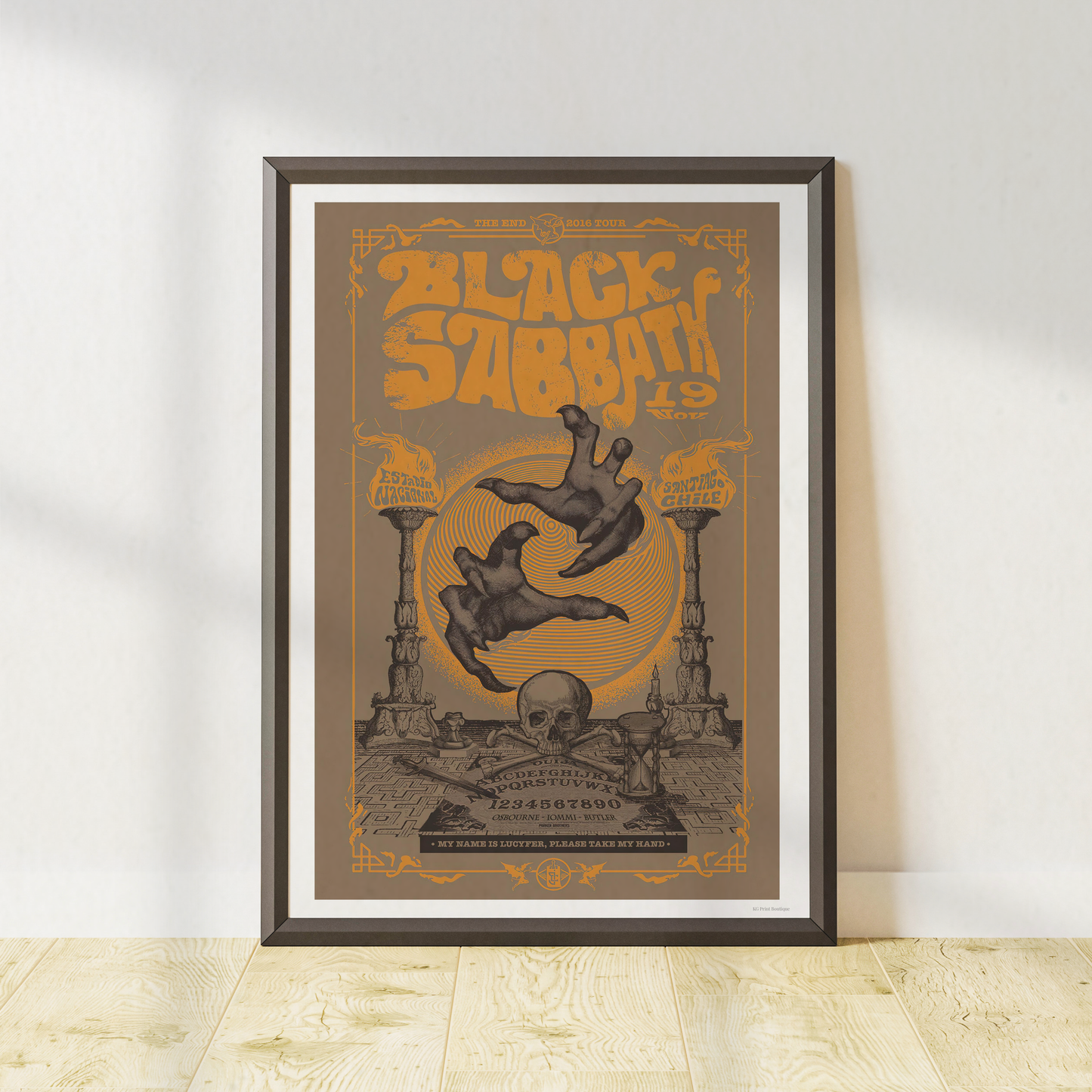 Black Sabbath vintage concert-style poster in a black frame featuring gothic artwork and heavy metal-inspired typography.