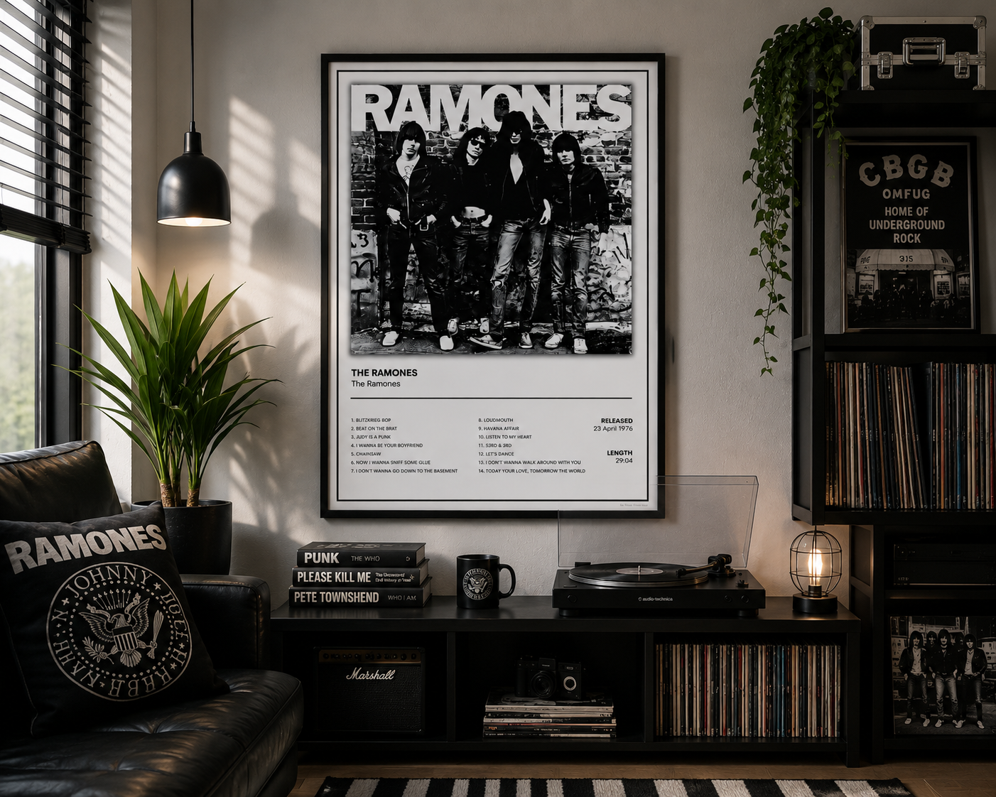 A framed black-and-white Ramones poster hangs on a wall in a styled room with a record player, shelves, plants, and a leather chair. The poster features the band's logo and album artwork.
