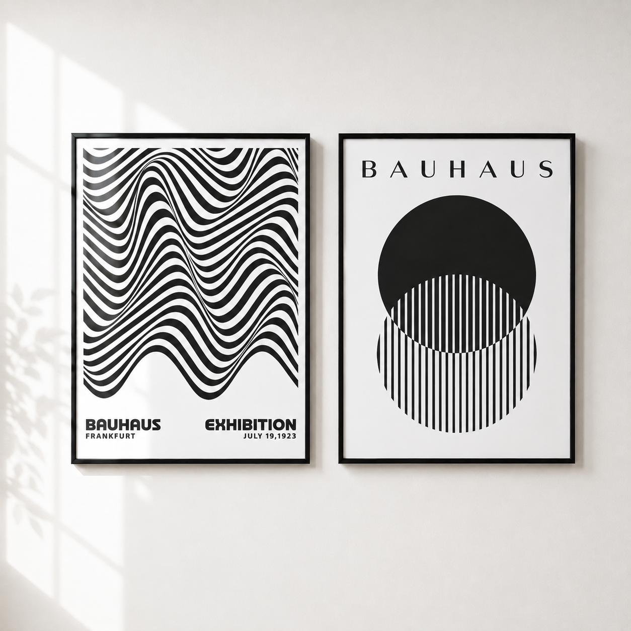 Two framed Bauhaus art prints hanging side-by-side on a white wall, with soft window shadow patterns visible on the left side of the wall.