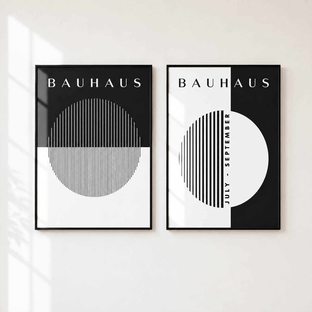 Two framed Bauhaus-style wall art prints hanging side by side on a white wall. Each print features black, white, and gray geometric shapes, including a large circle and vertical striped pattern, with the word 'BAUHAUS' at the top.