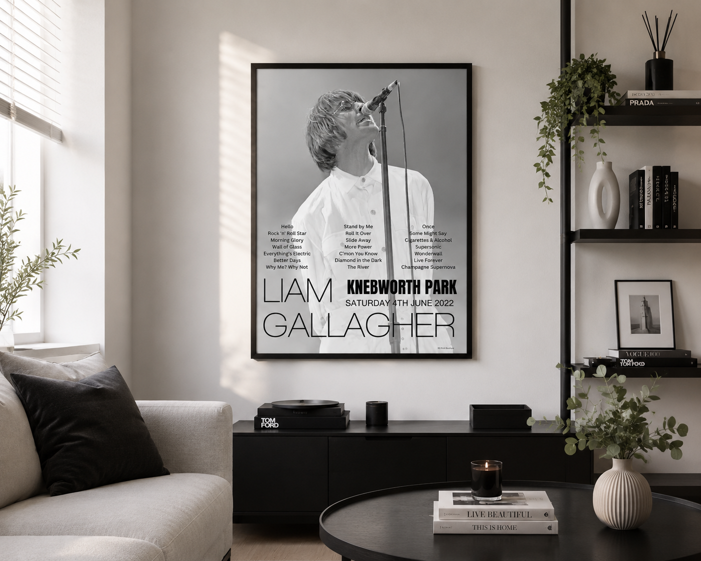 Framed Liam Gallagher Knebworth Park 2022 setlist wall art displayed in a stylish contemporary living room with modern black furniture.