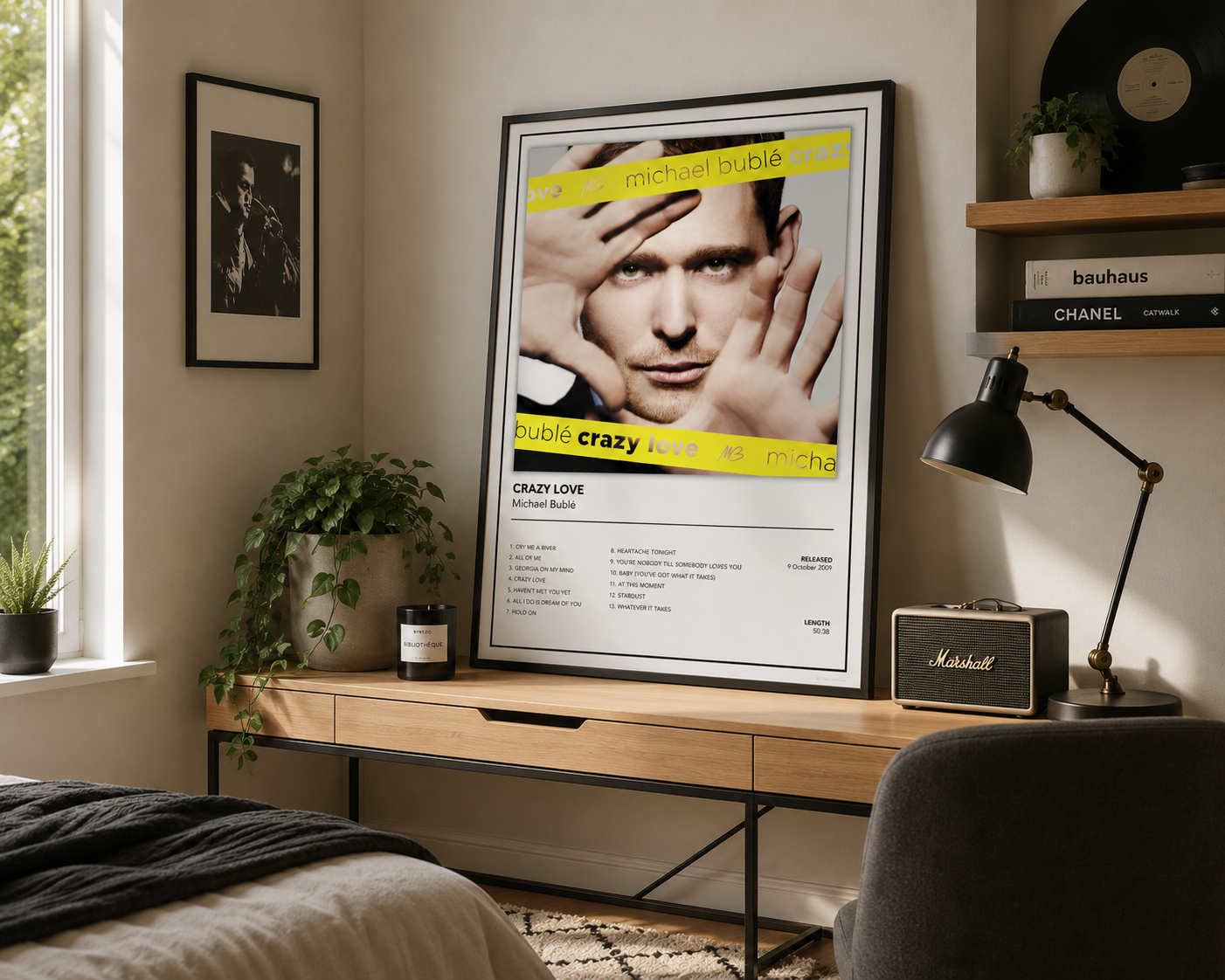 Framed Michael Bublé Crazy Love music poster styled on a modern bedroom desk with minimalist décor and soft natural light.
