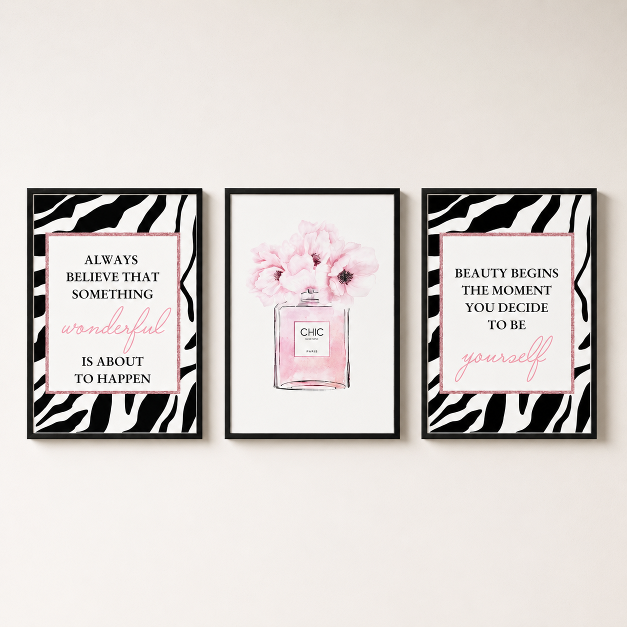 Modern blush pink wall art set featuring perfume bottle illustration and inspirational fashion quote prints in coordinating black, white and pink tones for stylish contemporary interiors.