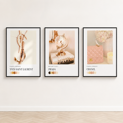 Neutral designer-inspired gallery wall with Chanel, Prada and Yves Saint Laurent fashion prints in black frames.