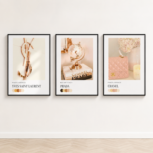 Neutral designer-inspired gallery wall with Chanel, Prada and Yves Saint Laurent fashion prints in black frames.