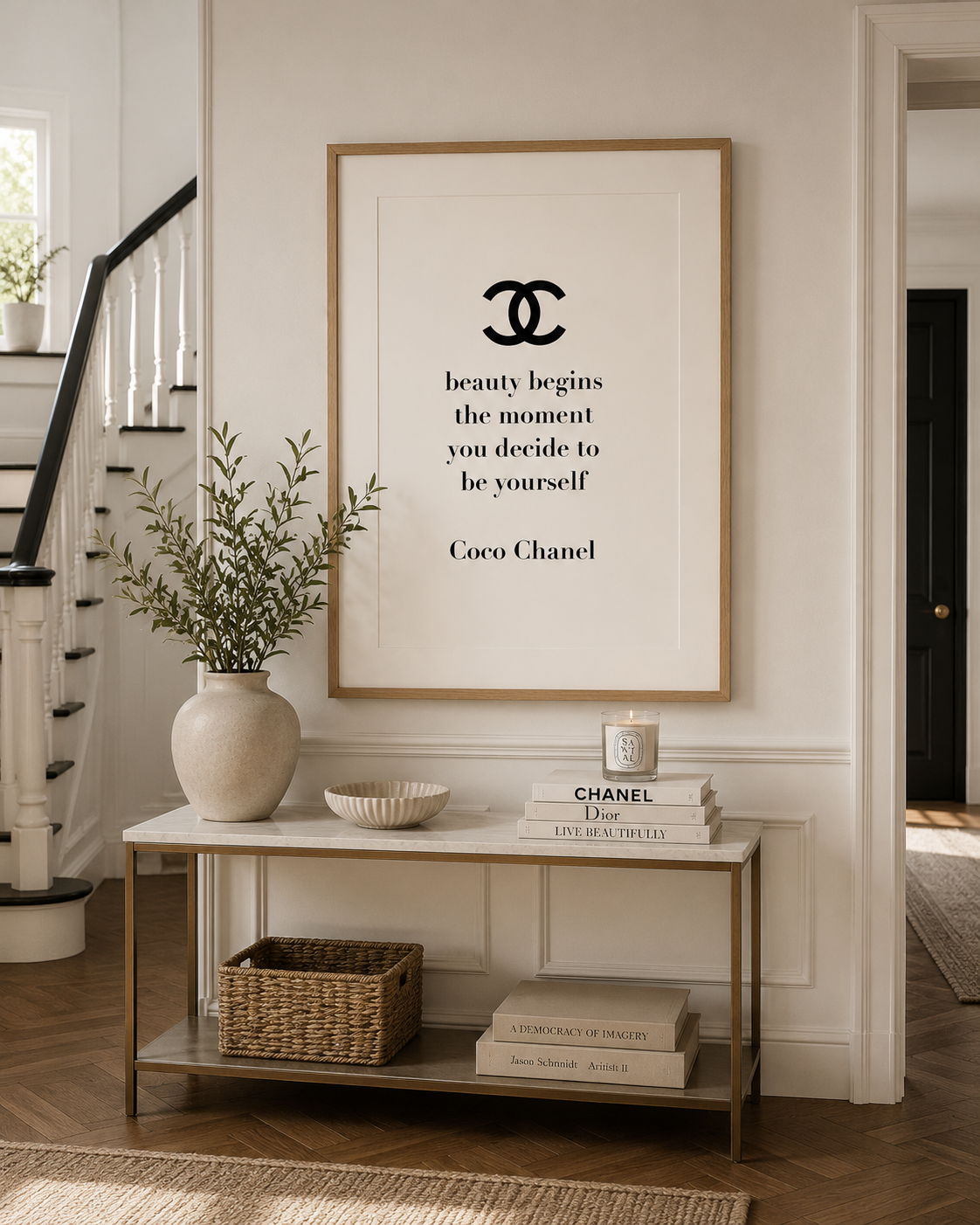 Luxury fashion quote print with Coco Chanel typography styled in a neutral hallway with Scandinavian-inspired décor.