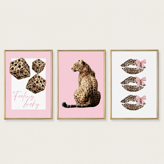 Leopard print wall art set of 3 with pink coquette bedroom decor featuring leopard portrait, lucky dice and leopard lips prints.