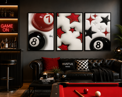 A three-panel framed wall art set featuring red and black billiard balls and stars, displayed above a black leather sofa in a modern dark room with a pool table and bar cabinet.