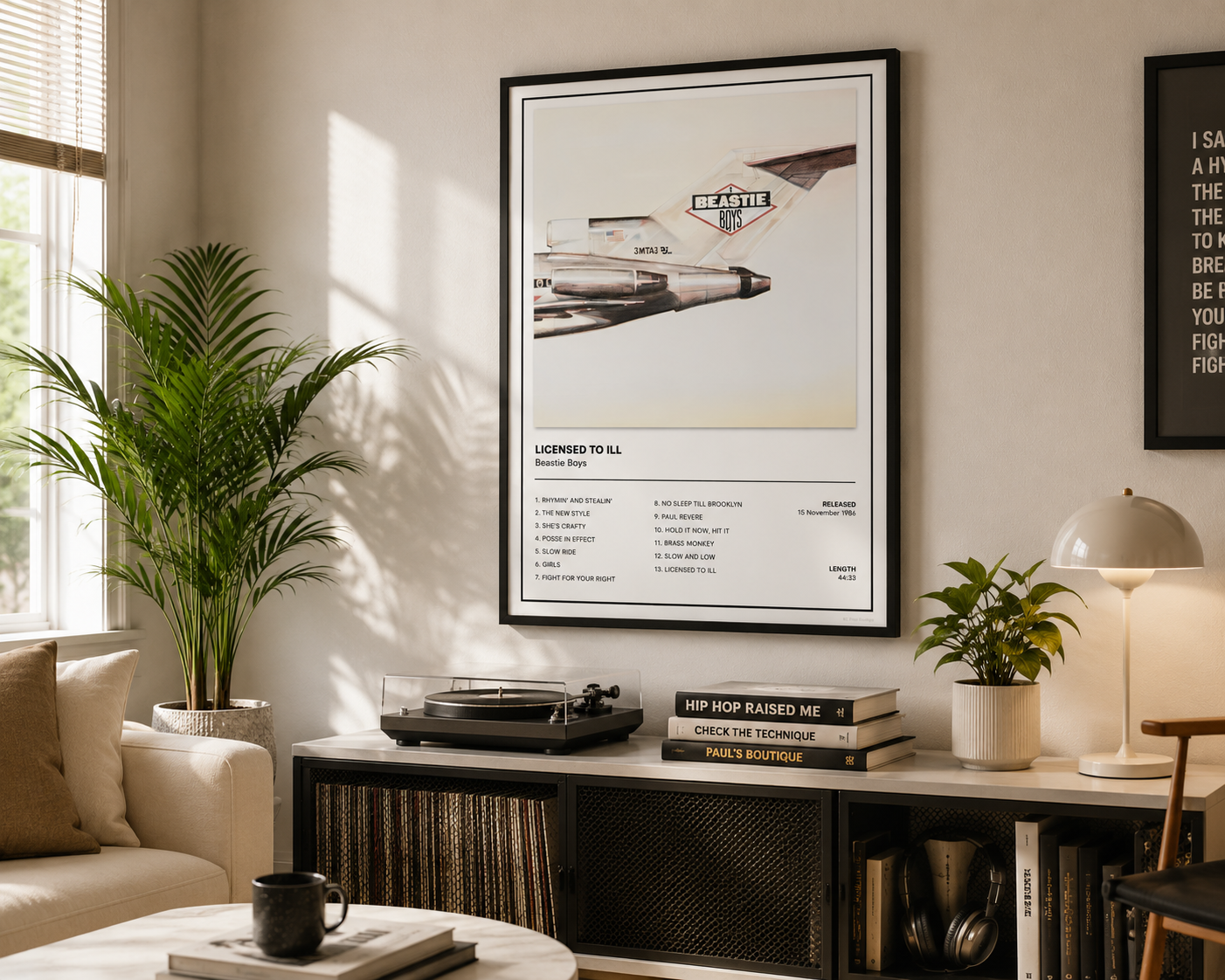 A framed poster featuring a vintage fighter jet and the text 'LEADER TO 54' hanging on a wall in a styled living room with a sofa, plant, lamp, and records on a console table.