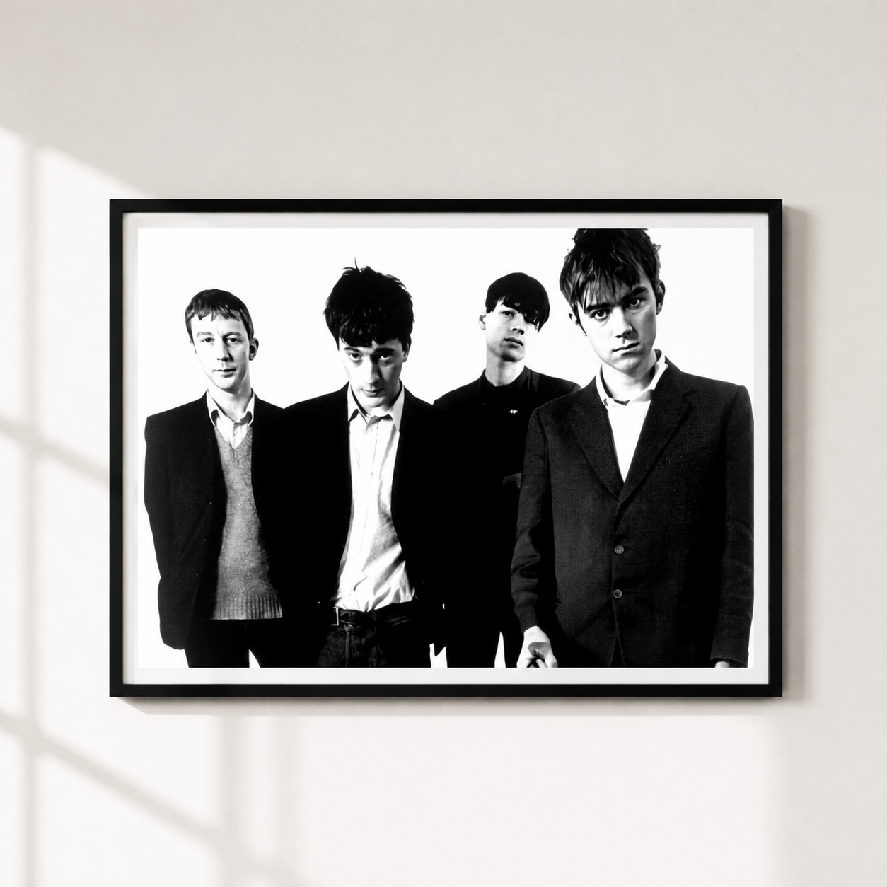 A black and white framed poster of the band Blur