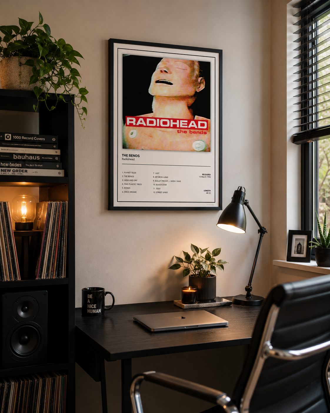 Framed Radiohead The Bends album cover print displayed in a modern home office with minimalist décor and black frame.