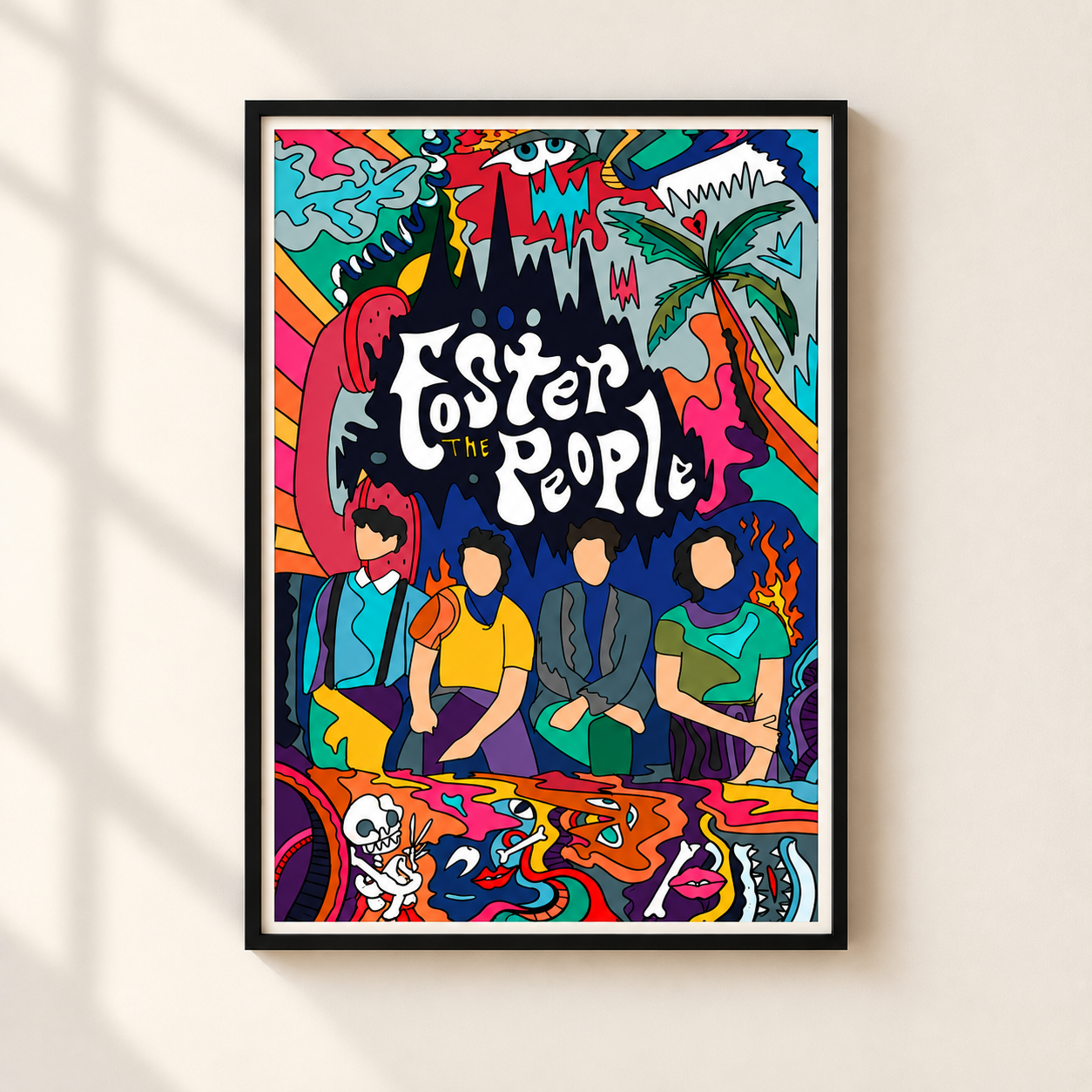 A framed colorful poster featuring stylized illustrated figures and the text 'Foster the People' in large white lettering, hanging on a light beige wall with soft window-shadow lighting.