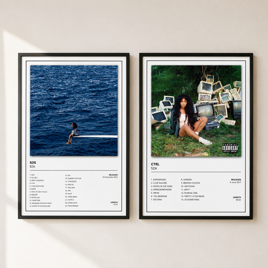 Two framed music album posters displayed side-by-side on a light beige wall. The left poster is for 'SOS' by SZA, featuring a photo of a person in the ocean with a tracklist below.