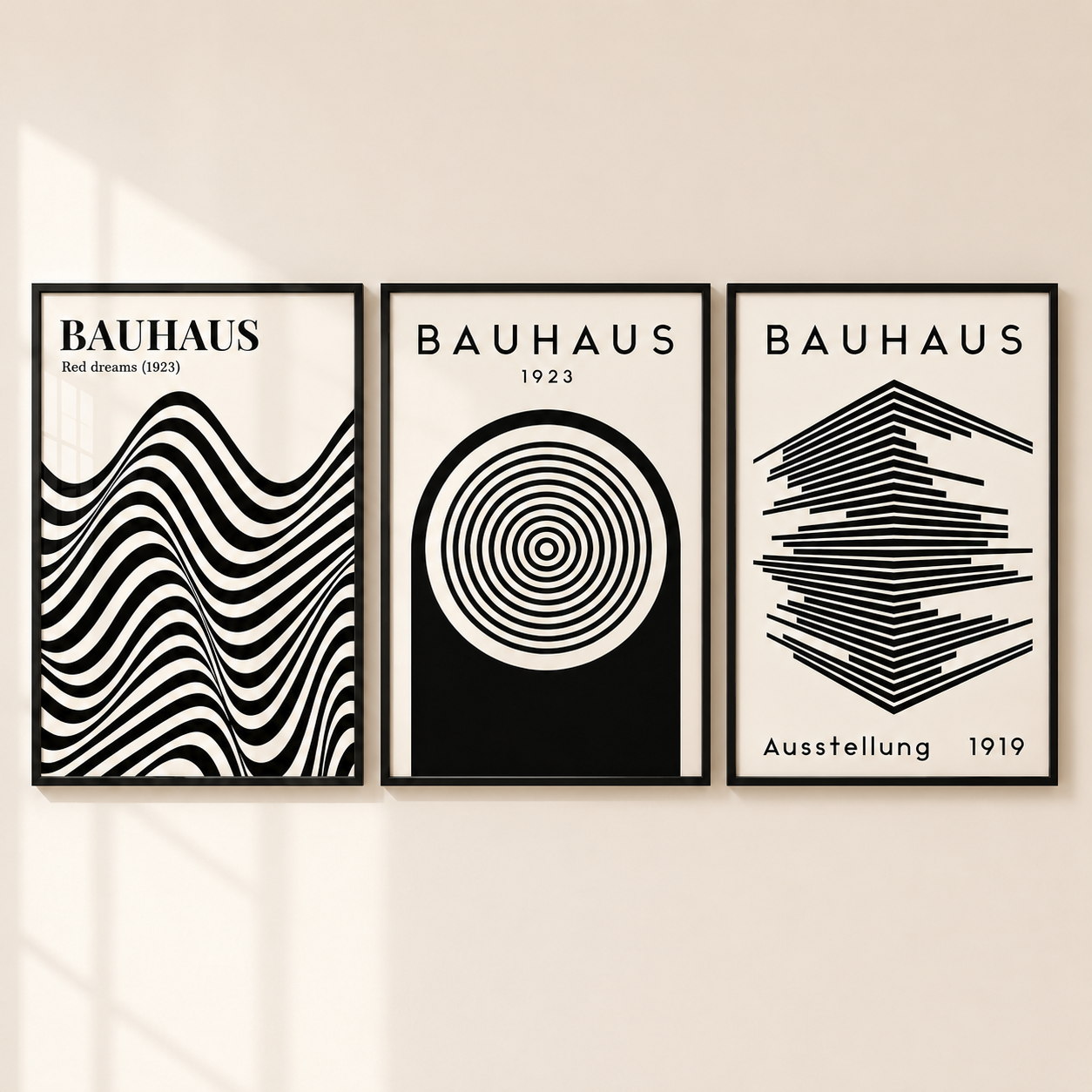 Three framed Bauhaus wall art prints in black and white, displayed side by side on a light beige wall.