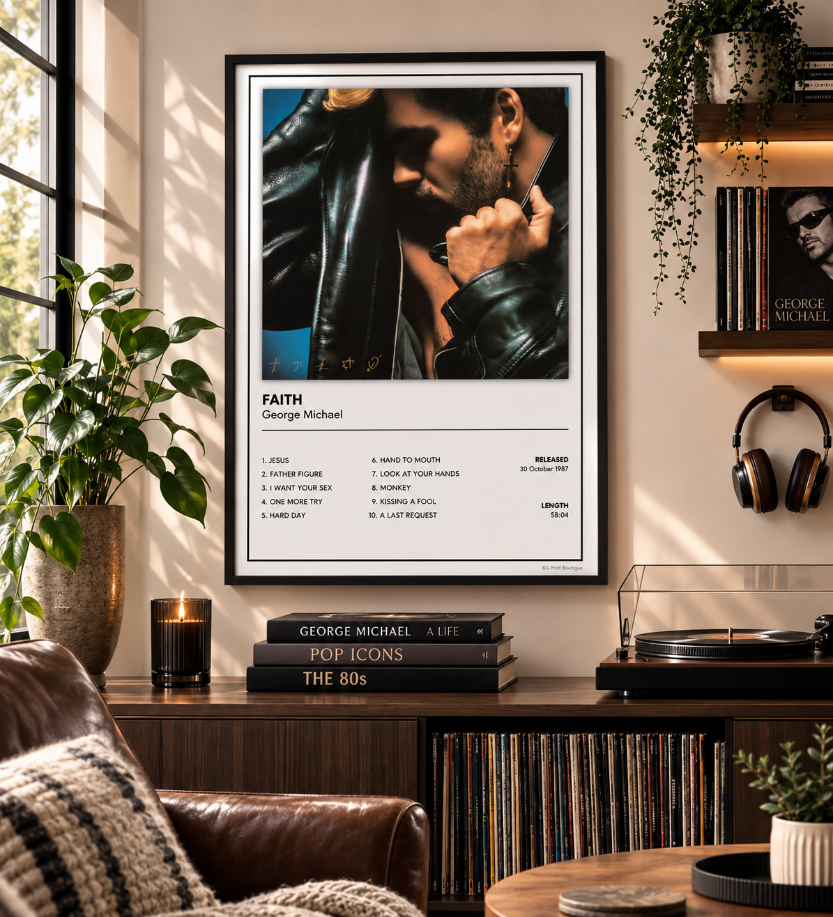 A framed wall poster featuring a portrait of George Michael and his song list for 'Faith' is displayed in a styled living room setting with a leather armchair, record player, and plants.