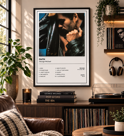 A framed wall poster featuring a portrait of George Michael and his song list for 'Faith' is displayed in a styled living room setting with a leather armchair, record player, and plants.