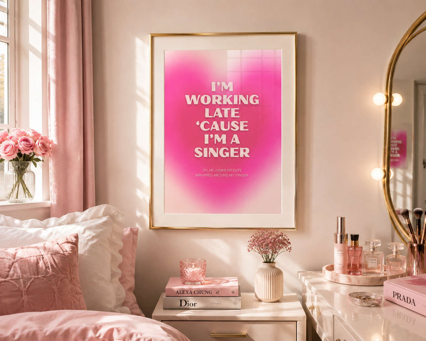 A framed art print with the text 'I'M WORKING LATE 'CAUSE I'M A SINGER' in white against a pink gradient background, hanging on a bedroom wall above a bedside table.