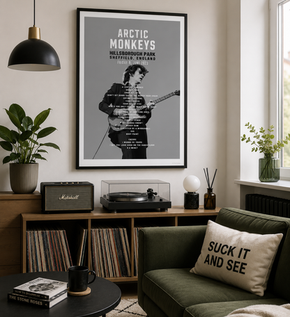 Minimalist Arctic Monkeys gig setlist wall art featuring the Hillsborough Park Sheffield concert, styled above a record cabinet in a modern music-inspired lounge.