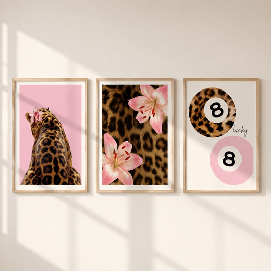Pink leopard wall art set of 3 featuring leopard portrait, floral leopard print and Lucky 8 fashion poster in light oak frames.