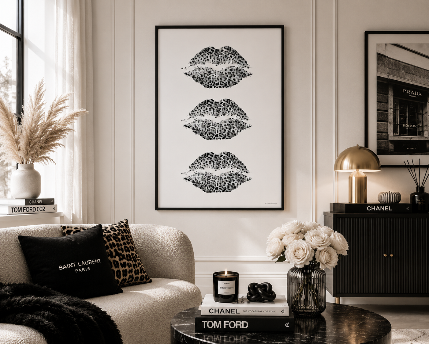 A framed black and white art print featuring three vertical rows of textured lips, displayed on a white paneled wall in a modern living room setting.