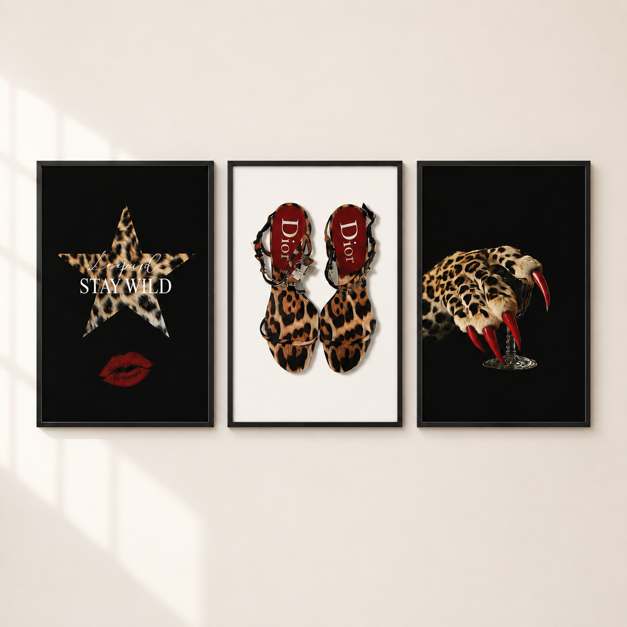 Three framed fashion art prints displayed side-by-side on a light beige wall. The left print features a leopard-print star with the text 'STAY WILD' and red lips on a black background.
