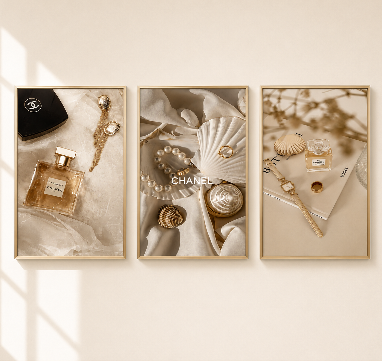 Three framed wall art prints with a warm beige and cream aesthetic, featuring Chanel perfume bottles, seashells, pearls, and a black Chanel box. The frames are displayed on a light beige wall with soft window shadows.