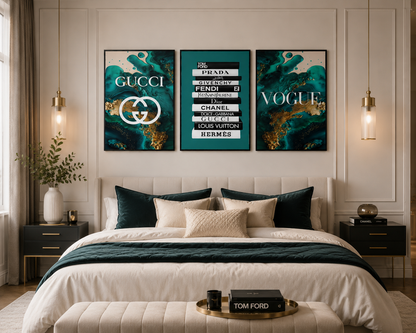 A styled bedroom with a three-panel wall art set above the bed. The artwork features luxury brand names and logos in white text over deep teal, black, and gold abstract backgrounds.