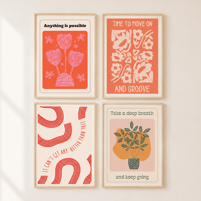 Four framed art prints arranged in a 2x2 grid on a light beige wall. The prints feature minimalist retro-style illustrations in coral, pink, cream, and green with motivational text such as 'Anything is possible,' 'Time to move on and groove,' 'I can't get any better than this,' and 'Take a deep breath and keep going.