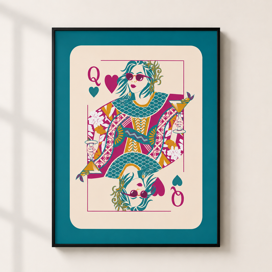 A framed art print of a stylized Queen playing card illustration, featuring a colorful character in a patterned dress on a cream background with a teal border, mounted on a light beige wall.