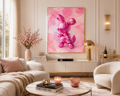 A framed pink art print featuring a glossy metallic pink balloon-style rabbit on a watercolor pink background, displayed on a cream wall in a modern, stylishly decorated living room.