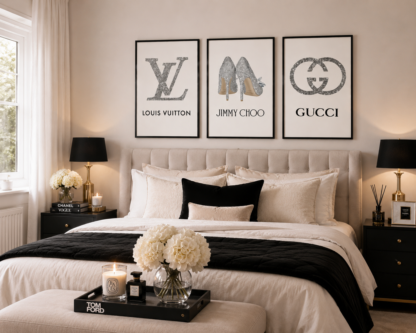 A styled bedroom scene with three framed wall art prints above a bed. The prints feature a Louis Vuitton monogram, a Jimmy Choo high-heel illustration, and a Gucci interlocking G logo, all in black frames.