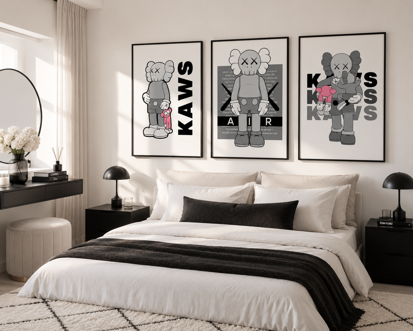 Three framed KAWS art prints in black, white, and gray hang above a neatly made bed in a modern, neutral-toned bedroom.
