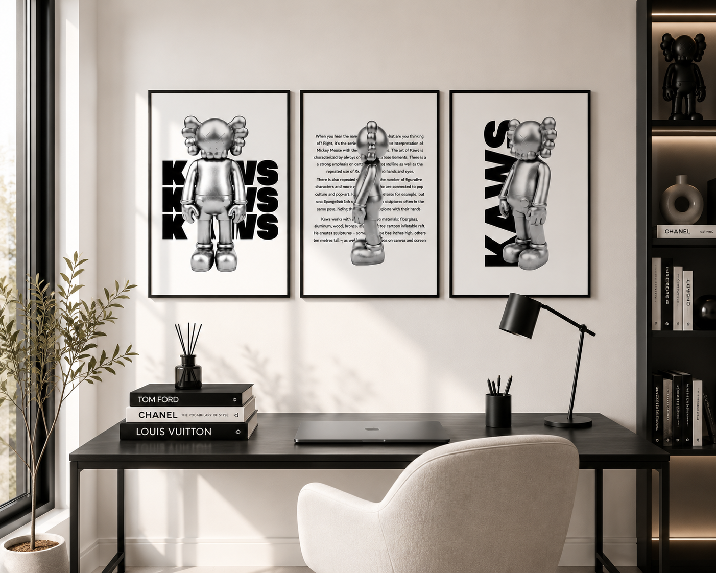 Three framed black and white art prints featuring KAWS character designs are displayed on a white wall above a black desk in a modern home office setting.