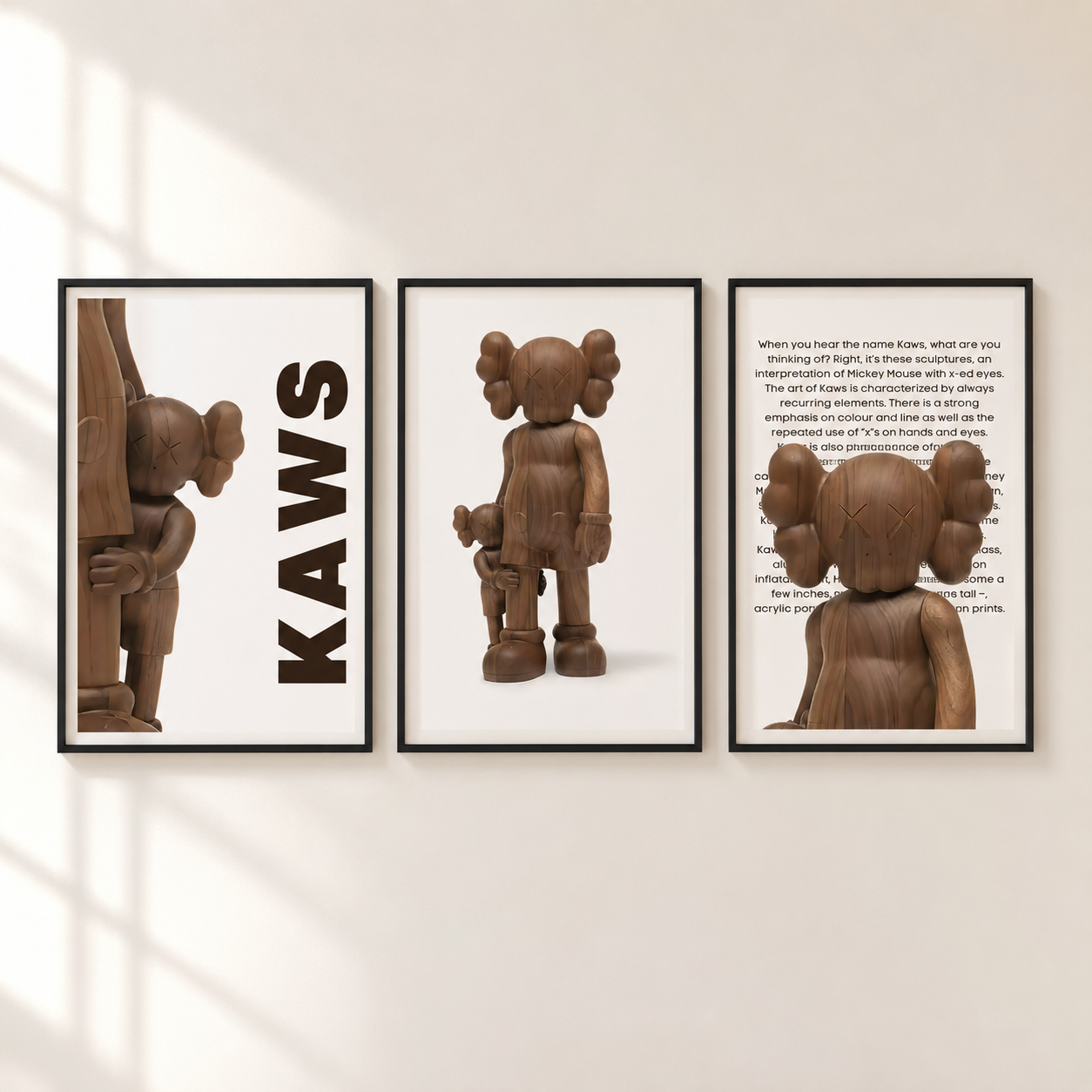 Three framed wall art prints featuring a brownKAWS character design, displayed side-by-side on a light beige wall with soft window shadow patterns.