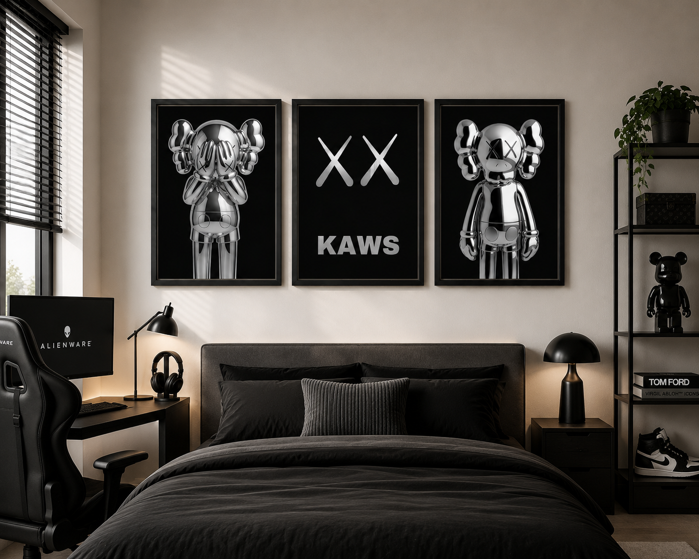A three-piece framed wall art set featuring metallic silver cartoon bear figures and the text 'XX KAWS' on a black background, displayed above a bed in a modern black-themed bedroom.