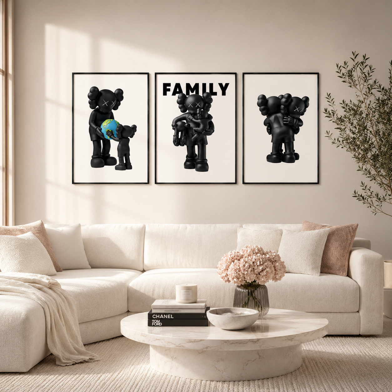 A three-piece framed wall art set featuring black cartoon bear figures and the word FAMILY, displayed above a white sectional sofa in a bright, modern living room.