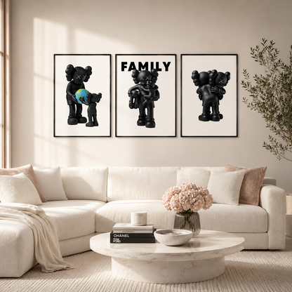 A three-piece framed wall art set featuring black cartoon bear figures and the word FAMILY, displayed above a white sectional sofa in a bright, modern living room.