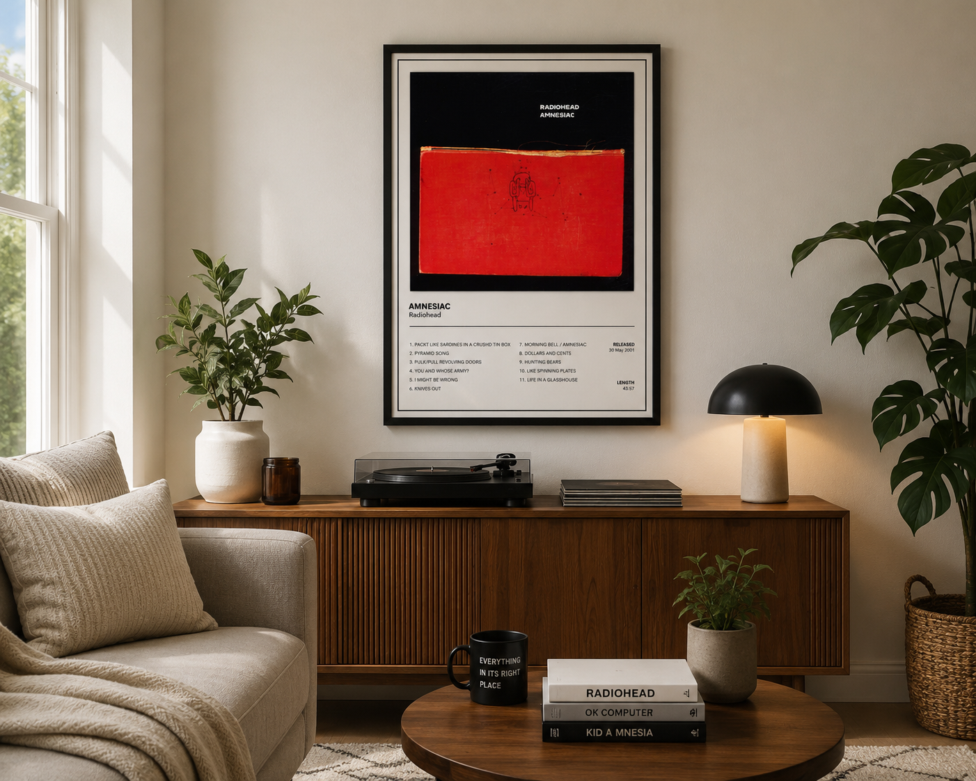 Framed Radiohead Amnesiac album artwork displayed in a bright contemporary living room with neutral modern décor.