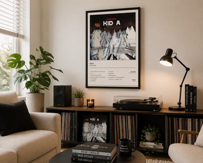 Framed Radiohead Kid A album artwork displayed in a bright contemporary living room with modern neutral décor.