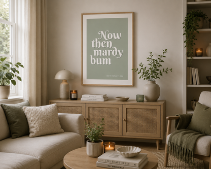 Minimalist sage green Arctic Monkeys lyric wall art featuring elegant cream typography in a contemporary oak frame.